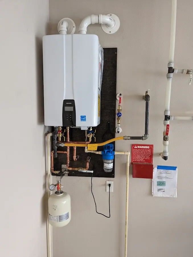 Professional plumber installing copper piping in a Ormond-by-the-Sea home